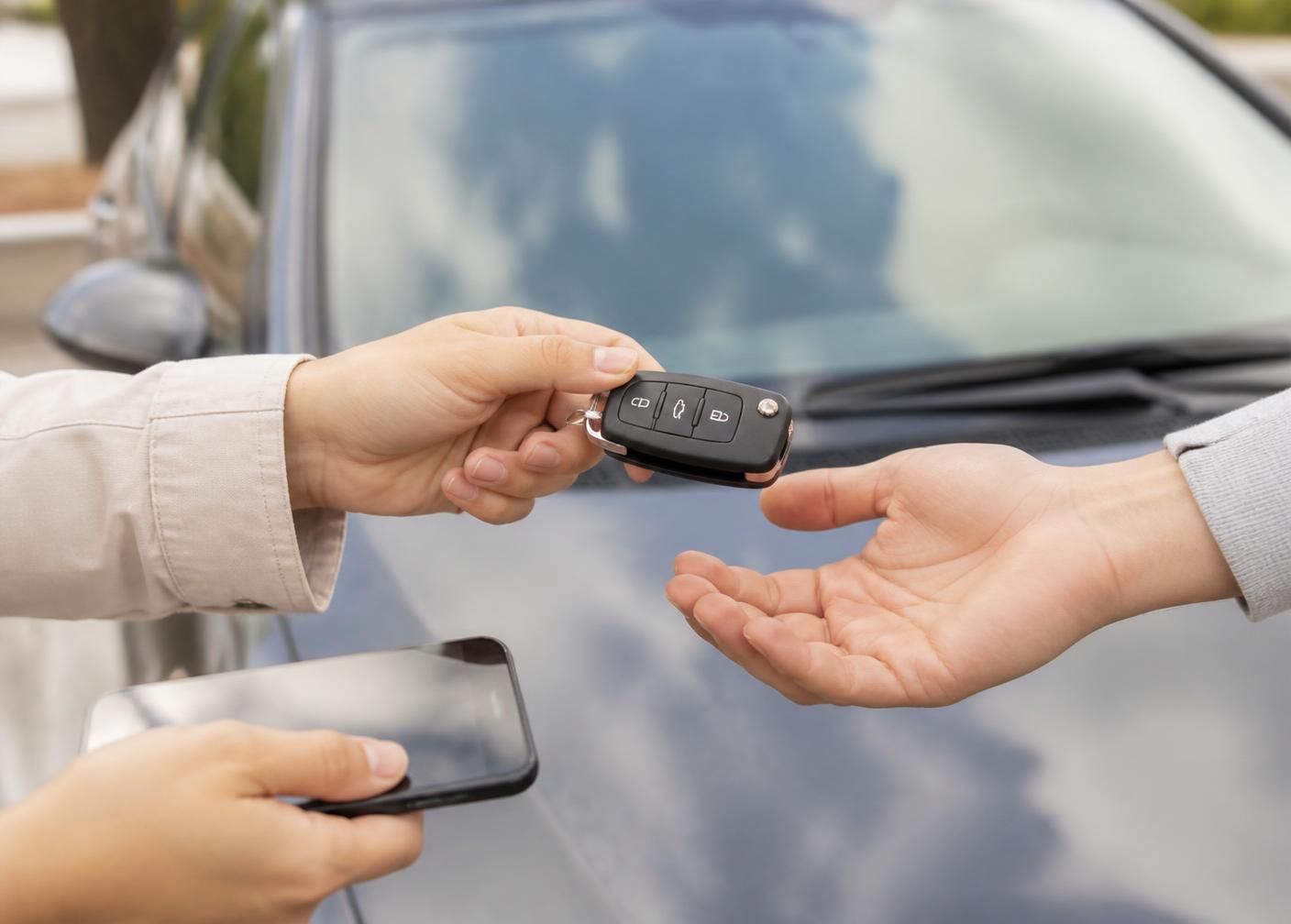 Car keys being handed over after a completed sale